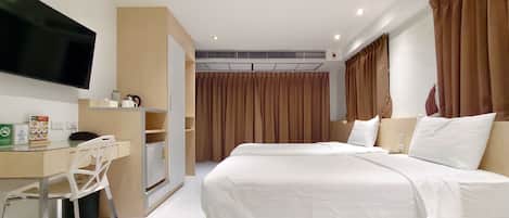 Deluxe-Zimmer, 2 Einzelbetten | Zimmersafe, kostenloses WLAN, Bettwäsche