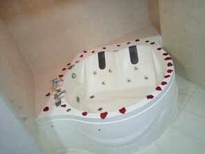 Shower, designer toiletries, towels