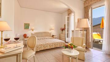 Double Room, Courtyard View | Minibar, in-room safe, individually decorated, individually furnished