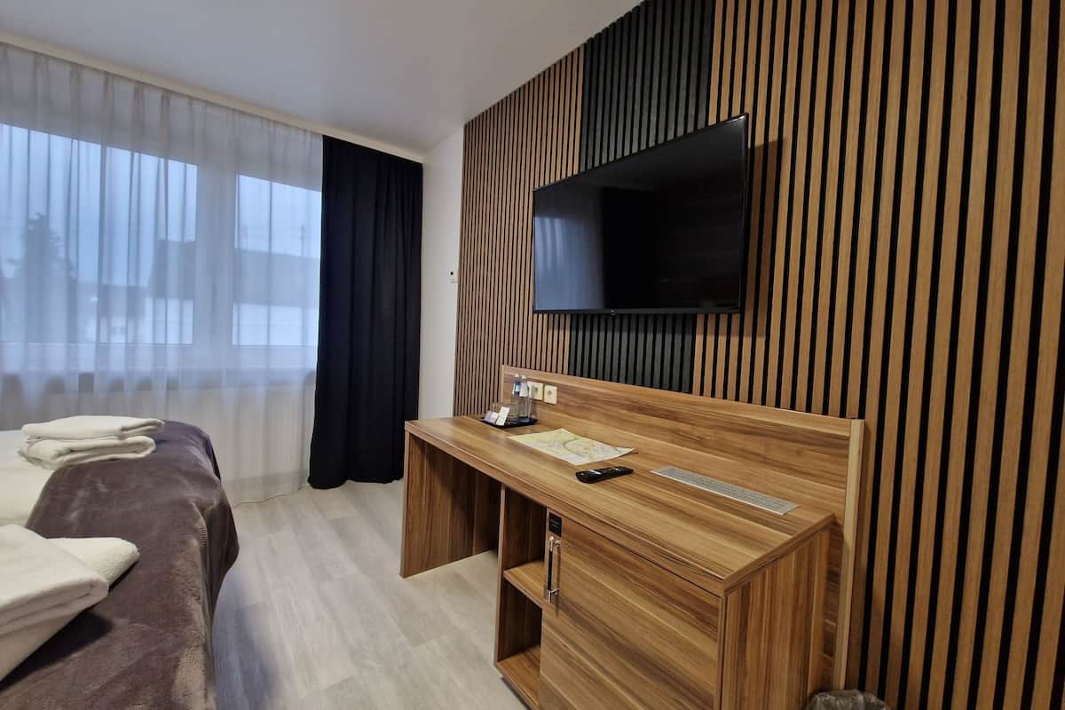 Habitación individual | Minibar, escritorio, cortinas blackout y insonorización