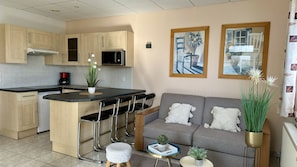 Superior Studio | Living area | 50-cm flat-screen TV with cable channels, TV - La Maison Blanche (Sangatte)