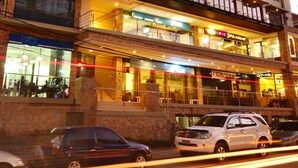 A multi-story hotel with balconies, a spa, and a visible restaurant. - Cocoon Boutique Hotel (Quezon City)