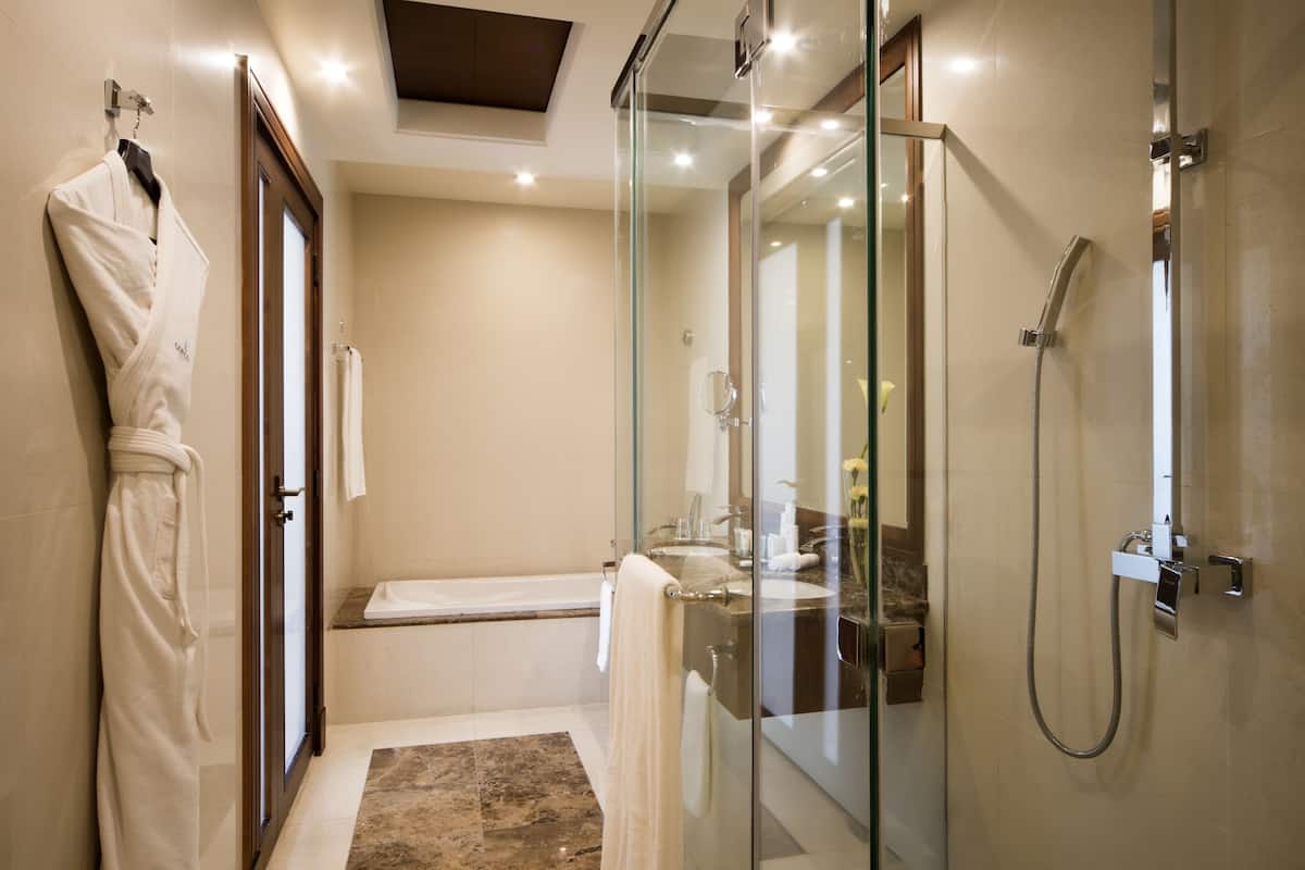 separate bathtub and shower, deep-soaking bathtub, rainfall showerhead