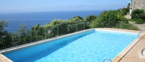 Outdoor pool, pool umbrellas, pool loungers