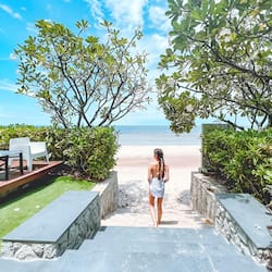 On the beach, white sand, beach umbrellas, beach towels