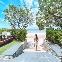 On the beach, white sand, beach umbrellas, beach towels
