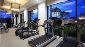 A gym with treadmills, elliptical machines, and weight equipment. - Avani Khon Kaen Hotel & Convention Centre (Khon Kaen)