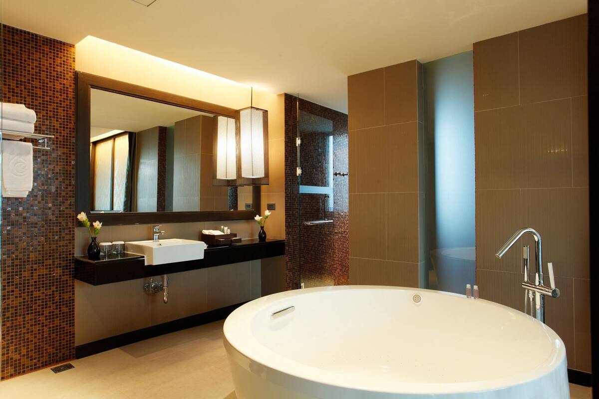 avani executive suite | bathroom | separate bathtub and shower, spring water bathtub, rainfall showerhead