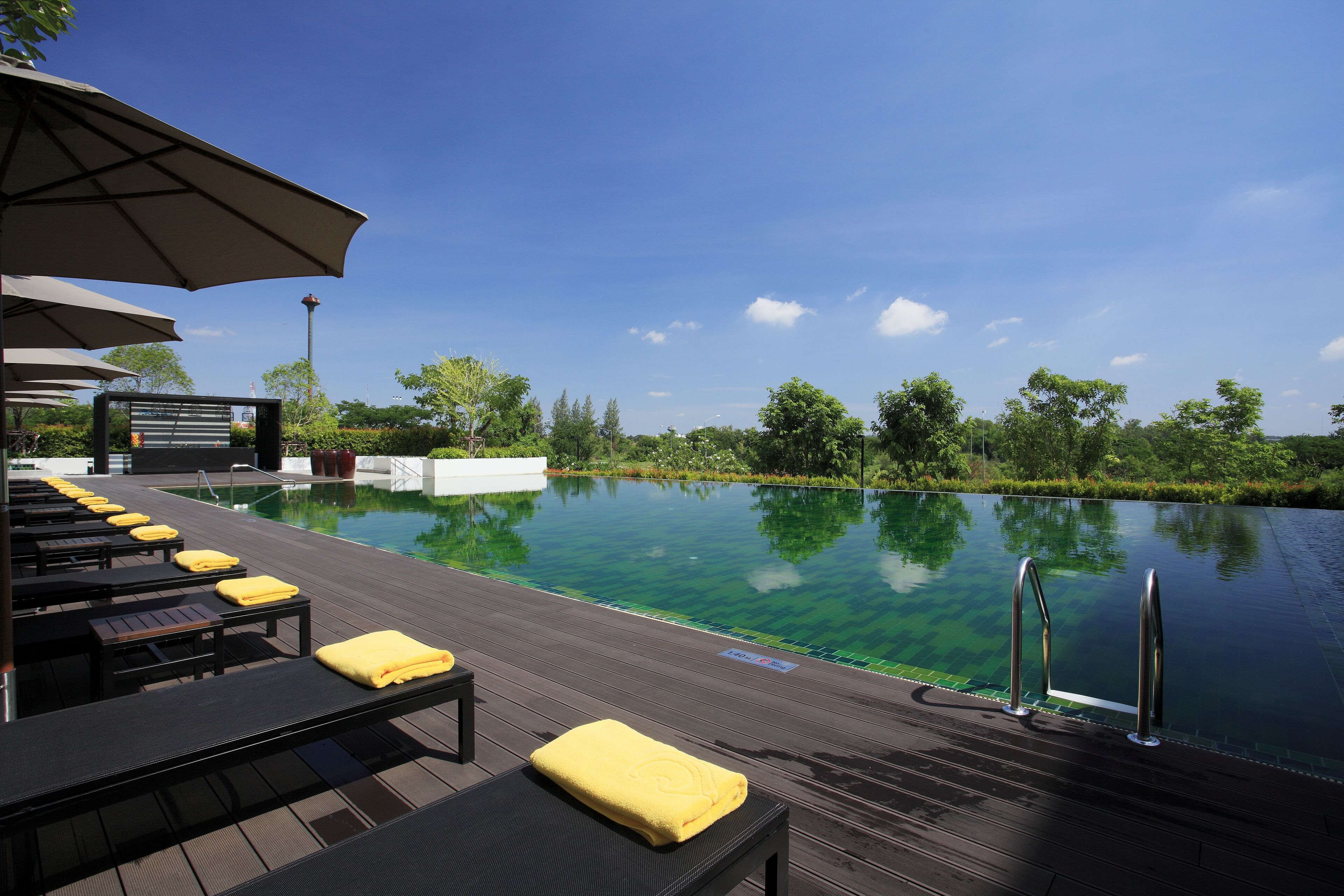 Outdoor pool, open 7:00 AM to 7:00 PM, free pool cabanas, pool umbrellas