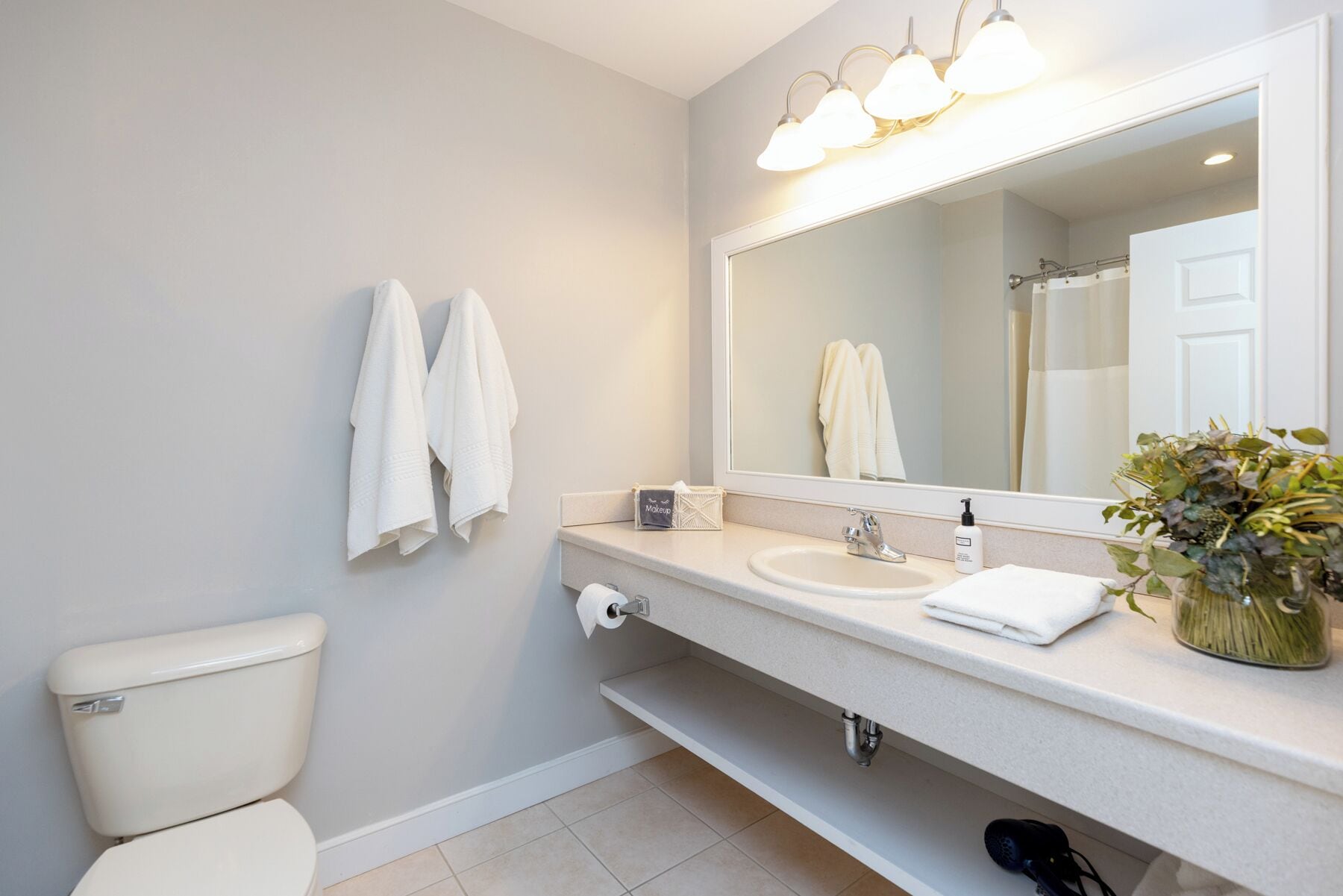 divided double queen room | bathroom | free toiletries, hair dryer, towels, soap