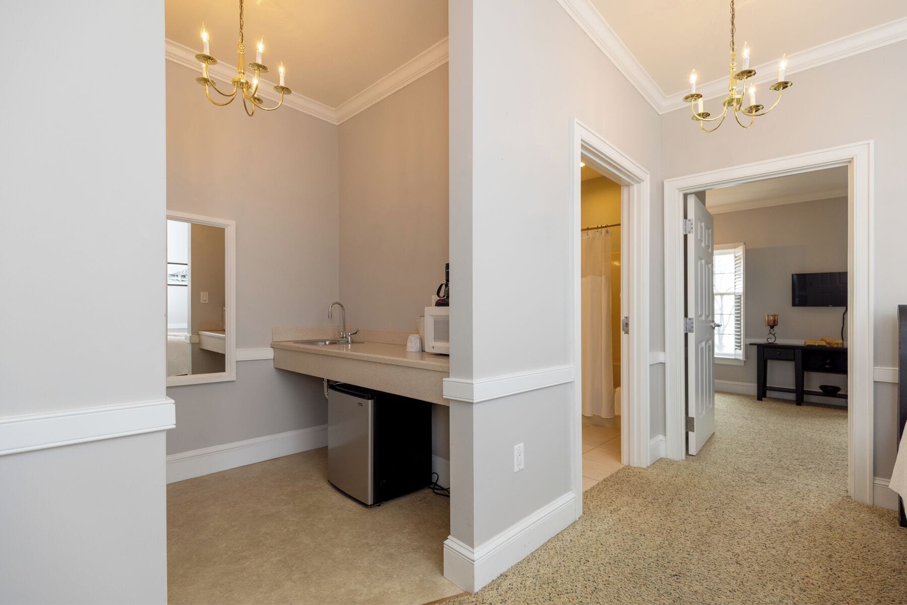 divided room, queen bed with queen sleep sofa | private kitchen | fridge, microwave, coffee/tea maker, dining tables