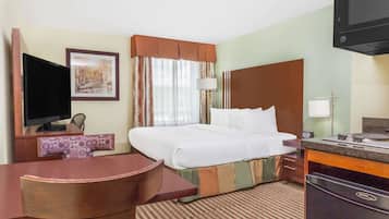 Desk, laptop workspace, blackout drapes, iron/ironing board