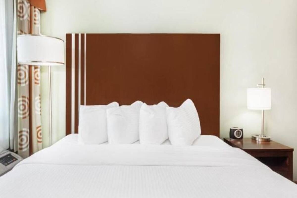 Desk, laptop workspace, blackout curtains, iron/ironing board