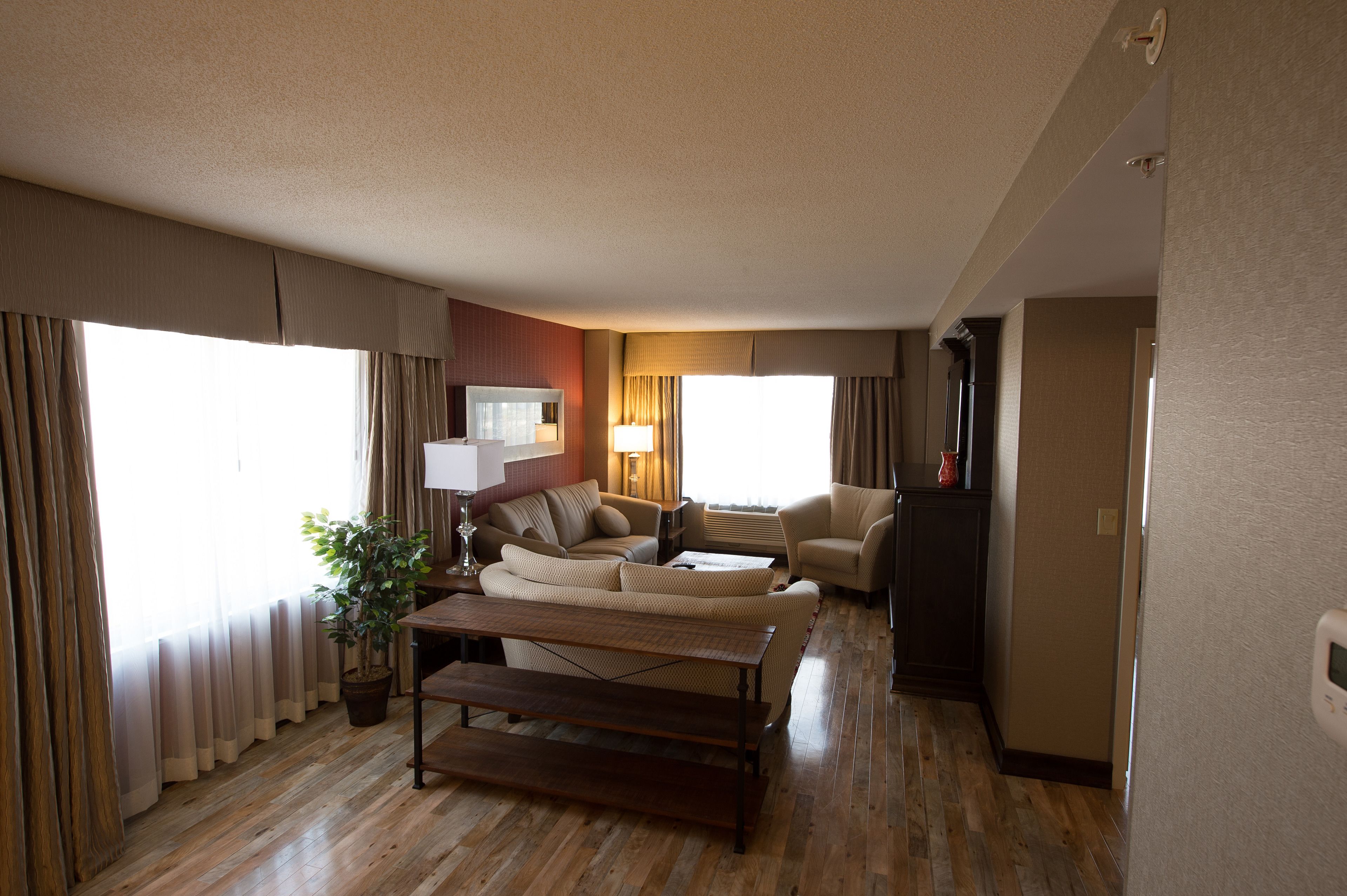 suite with king bed & living room | living room | 55-inch lcd tv with digital channels, tv, mp3 dock