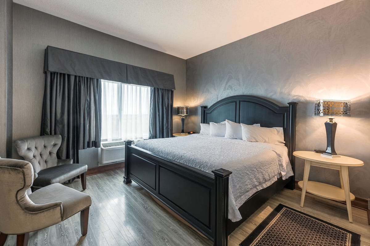 Suite with King Bed & Living Room | Premium bedding, pillowtop beds, desk, blackout drapes