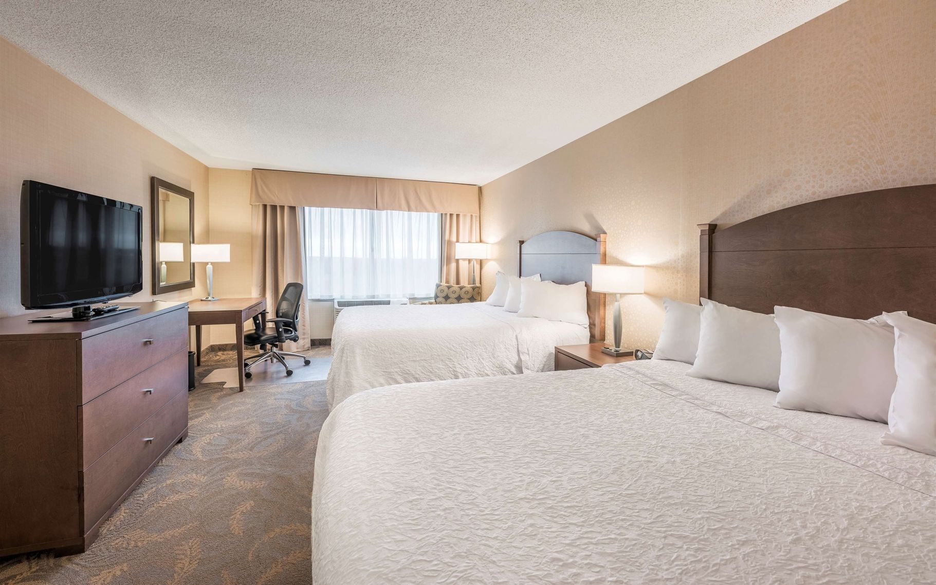 Premium bedding, pillowtop beds, desk, blackout drapes