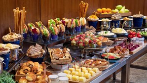 A buffet with various food items including bread, pastries, fruits, and cheeses. - Radisson Blu Hotel Istanbul Asia (Istanbul)