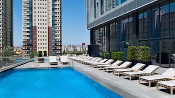 Seasonal outdoor pool, pool umbrellas, sun loungers