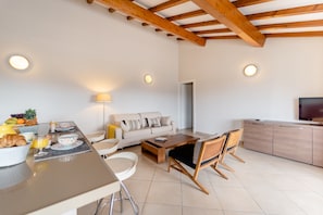 Deluxe Apartment, 2 Bedrooms, Terrace, City View | Living area | Flat-screen TV, ping pong