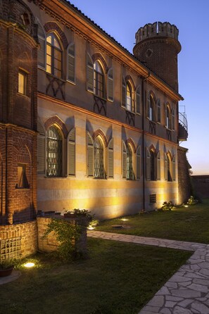 A historic building with arched windows and a tower.
