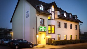 A two-story hotel with a prominent sign indicating it is a "Hotel Zum Lamm". - Hotel Weiße Elster (Zeitz)