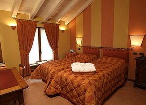 Premium bedding, down duvets, minibar, in-room safe