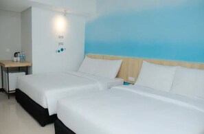 Luxe beddengoed, een minibar, een kluis op de kamer, een bureau