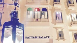 The exterior of Satyam Palace with a sign above the entrance. - Satyam Palace Resort (Pushkar)