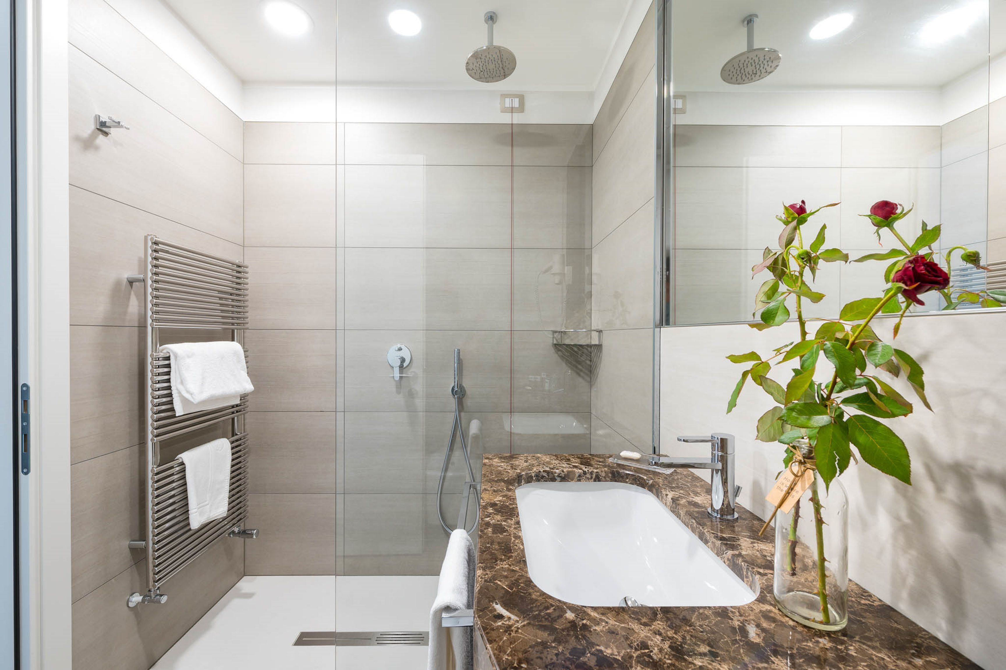 superior double room | bathroom | shower, rainfall showerhead, free toiletries, hair dryer