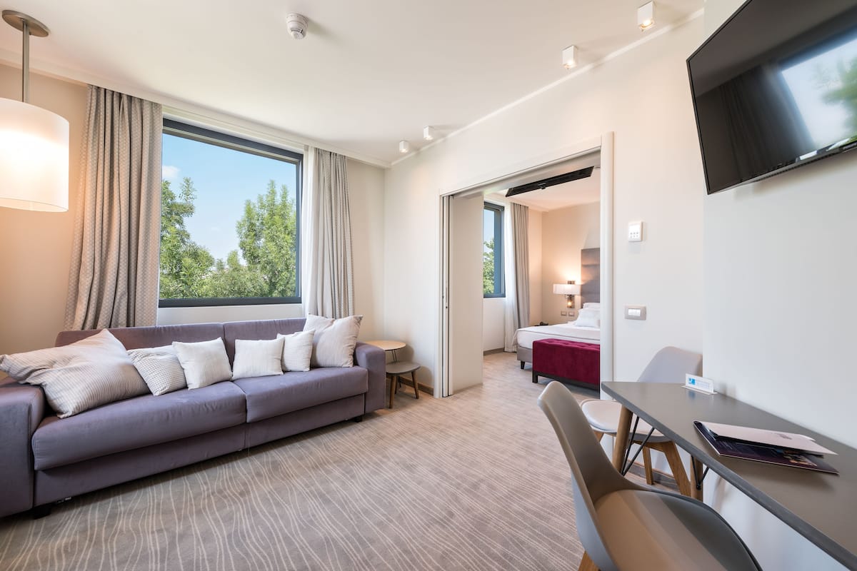 deluxe double room | living room | 32-inch flat-screen tv with digital channels, tv