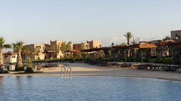 2 outdoor pools, open 10:00 AM to 6:00 PM, pool umbrellas