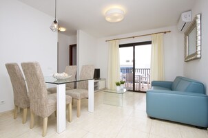 Apartment, 1 Bedroom (No Pool) | Living room | 32-inch flat-screen TV with satellite channels, TV