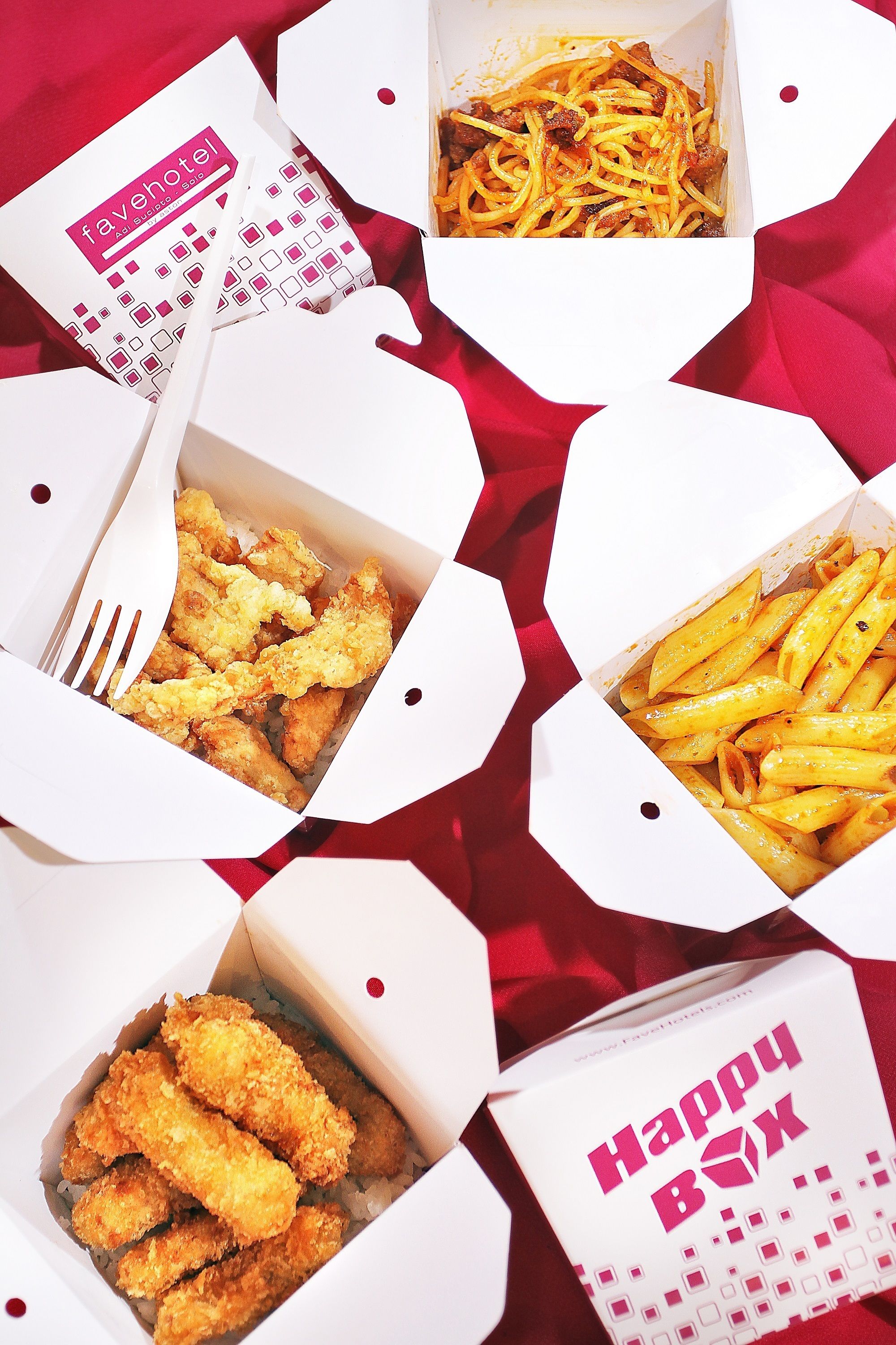Four takeout boxes with food items, each labeled with a different restaurant name.