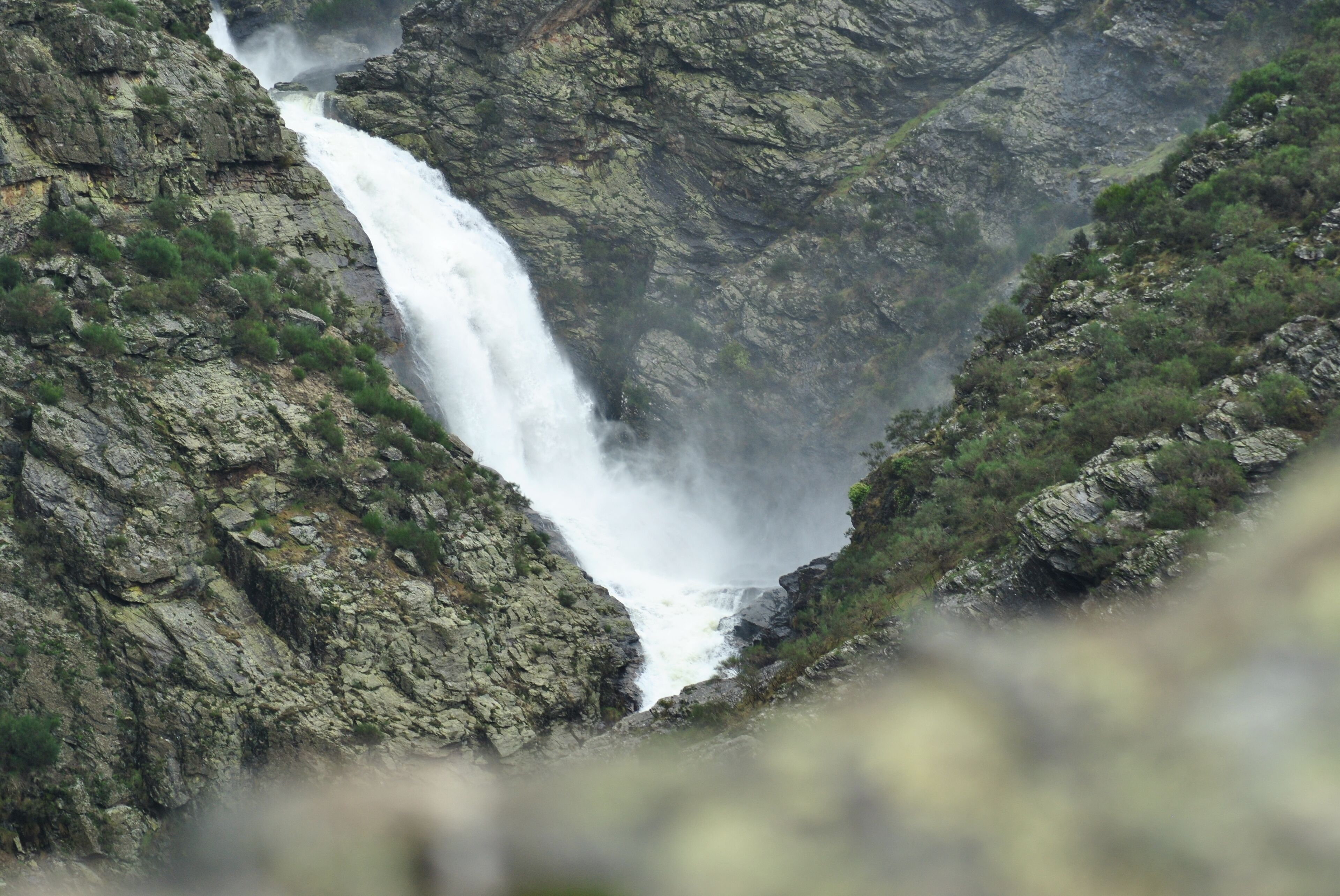 A waterfall cascading down a rocky cliff.