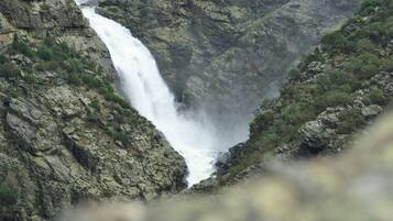 A waterfall cascading down a rocky cliff.