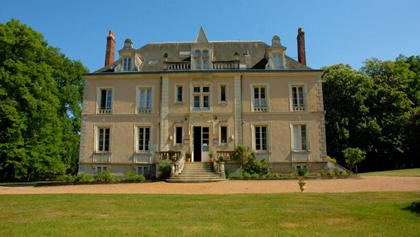 A large, two-story building with a symmetrical facade, multiple windows, and a central entrance with steps. - Domaine de Bel Air (Cerans-Foulletourte)