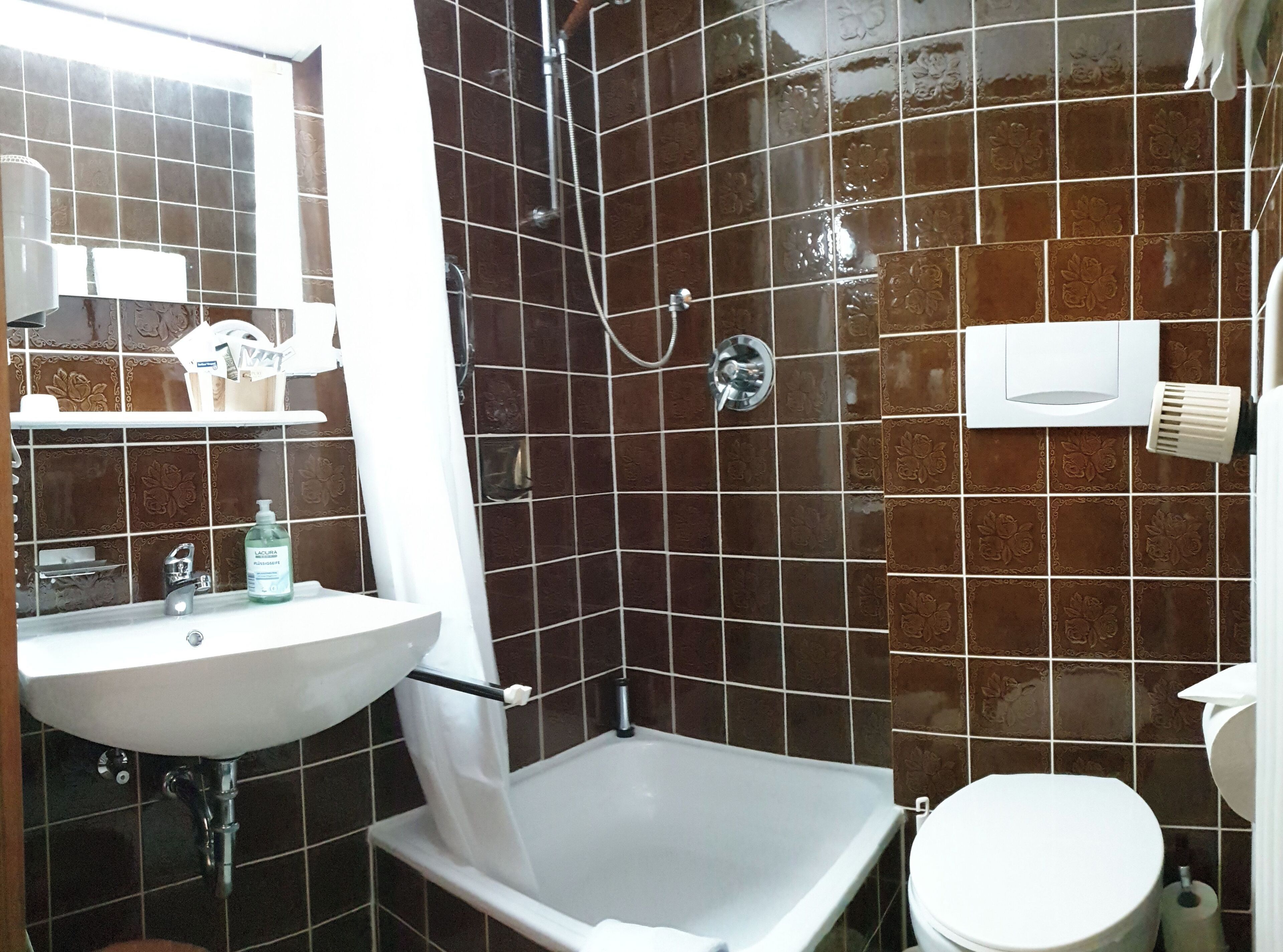 standard double room | bathroom | shower, hair dryer, towels