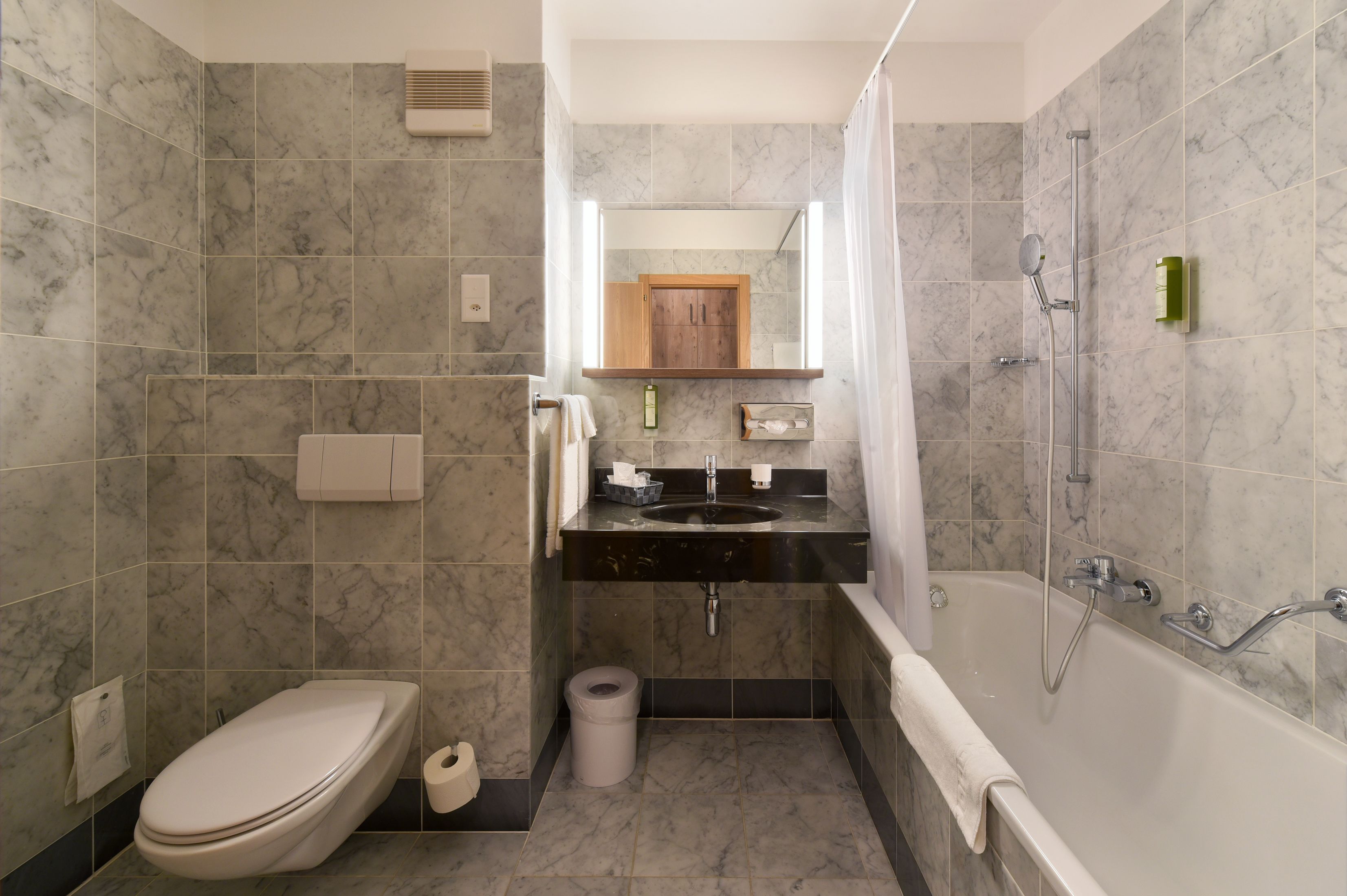 bathtub, free toiletries, hair dryer, slippers