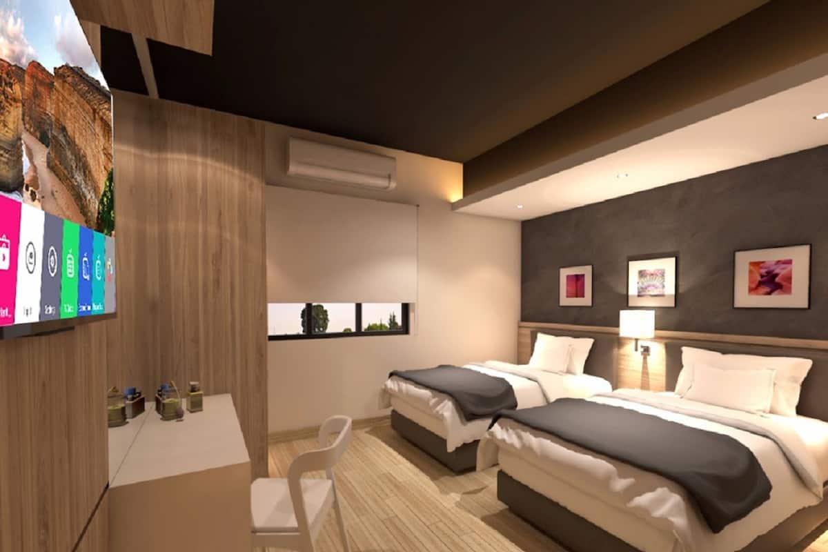 Deluxe Room, 2 Twin Beds | Down comforters, minibar, in-room safe, individually decorated