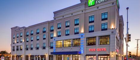 A Holiday Inn Express hotel with a Five Guys restaurant on the ground floor.