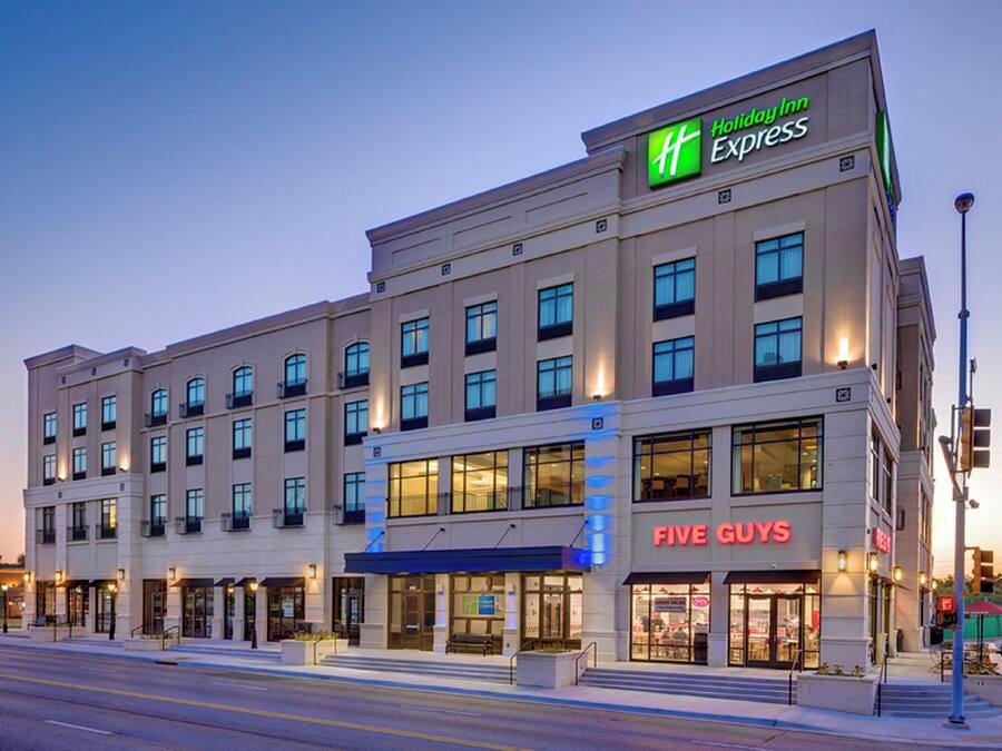 A Holiday Inn Express hotel with a Five Guys restaurant on the ground floor.