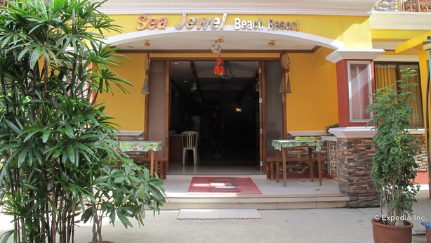 A hotel entrance with a sign reading "Sea Jewel Beach Resort". - Sea Jewel Beach Resort Puerto Galera (Puerto Galera)