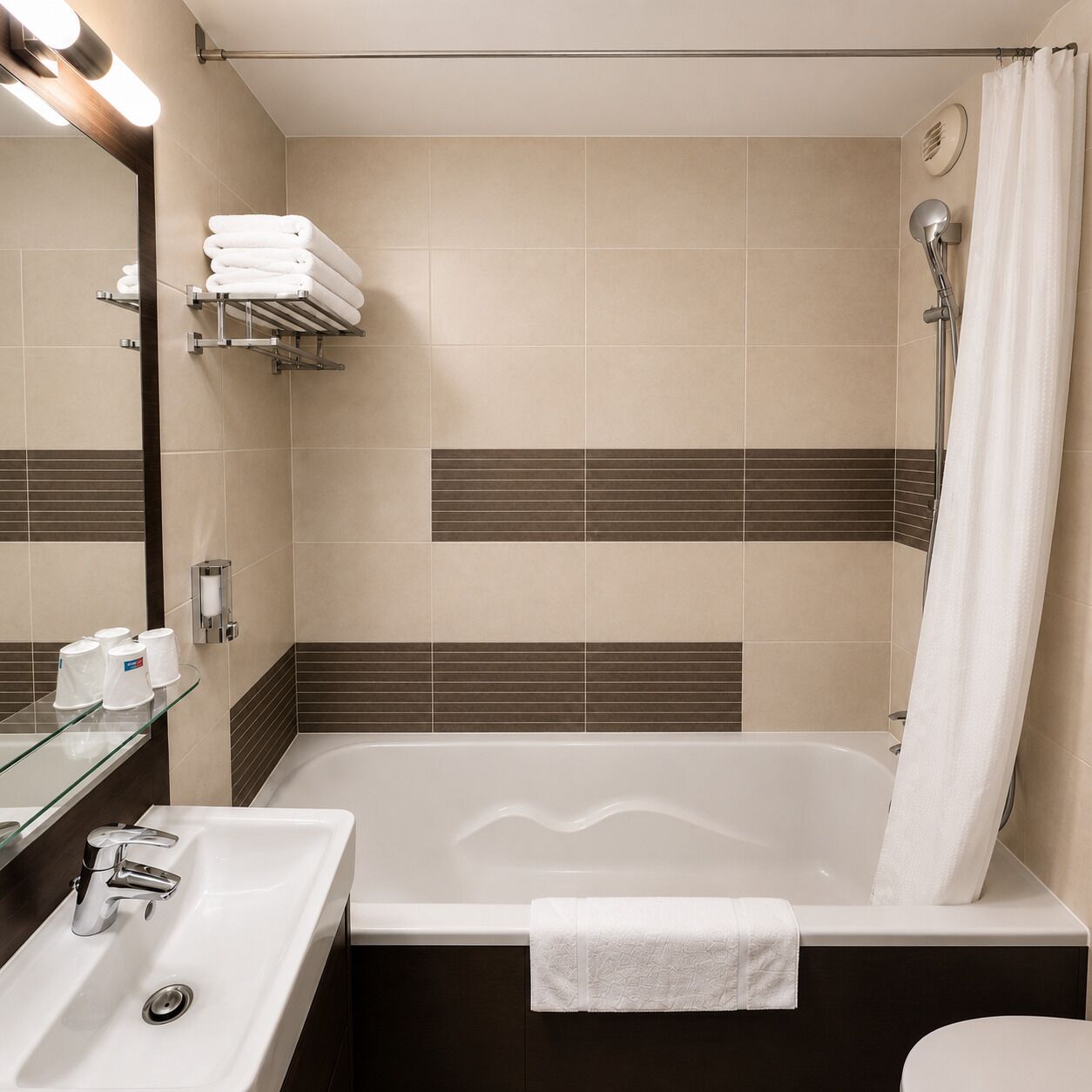 A modern bathroom with a bathtub, a sink, and a shower.