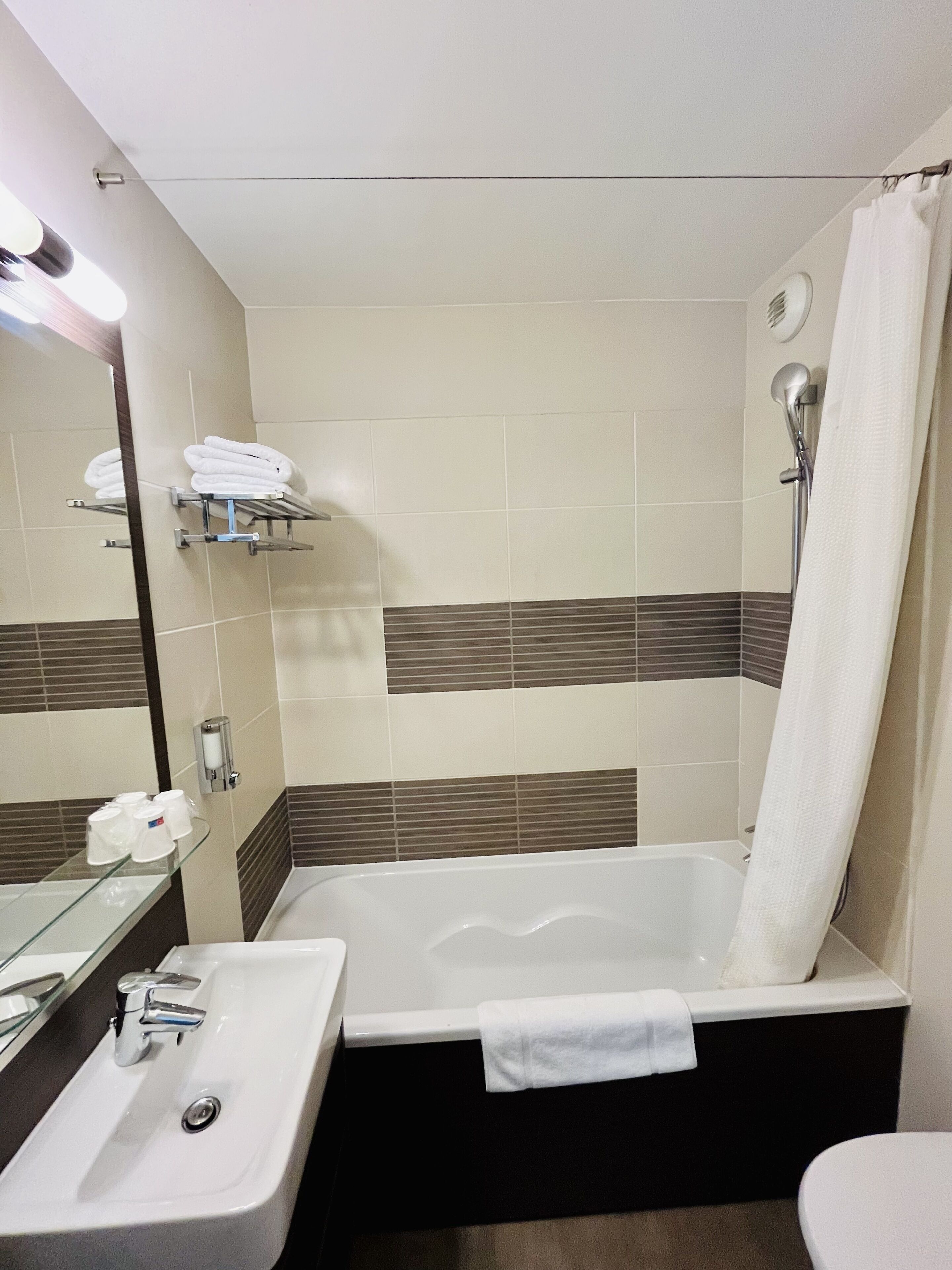 hair dryer, towels, soap, shampoo