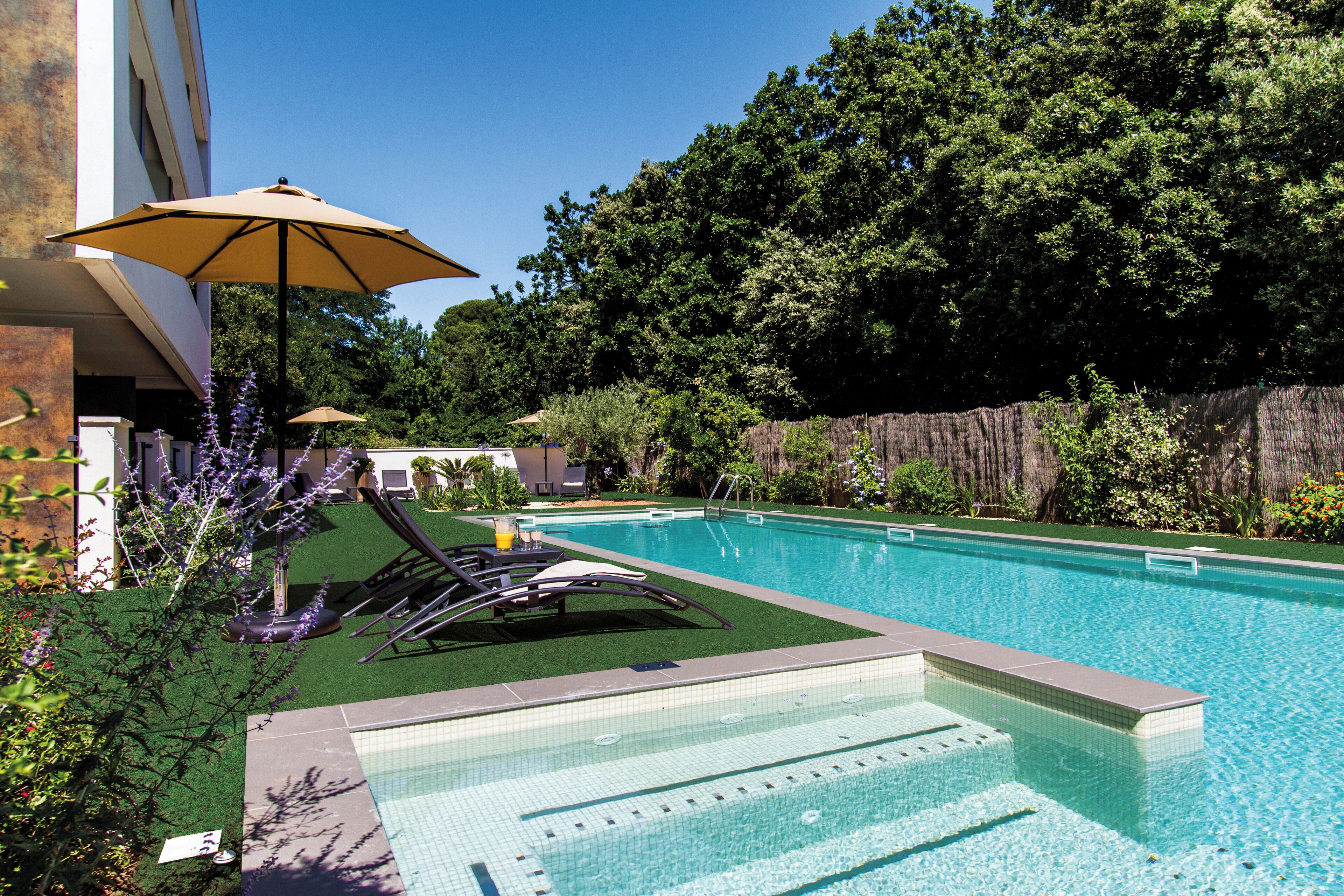 Seasonal outdoor pool, open 9:00 AM to 9:00 PM, pool umbrellas