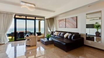 Luxury Suite, Sea View (Tanzanite) | Living area | Flat-screen TV