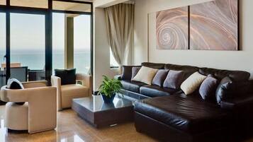 Luxury Suite, Sea View (Tanzanite) | Living area | Flat-screen TV