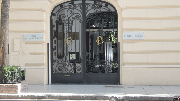The entrance to Hotel Club Frances with ornate black wrought iron gates and a classic architectural facade. - Hotel Club Frances (Buenos Aires)