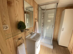 Shower, hair dryer, towels, toilet paper