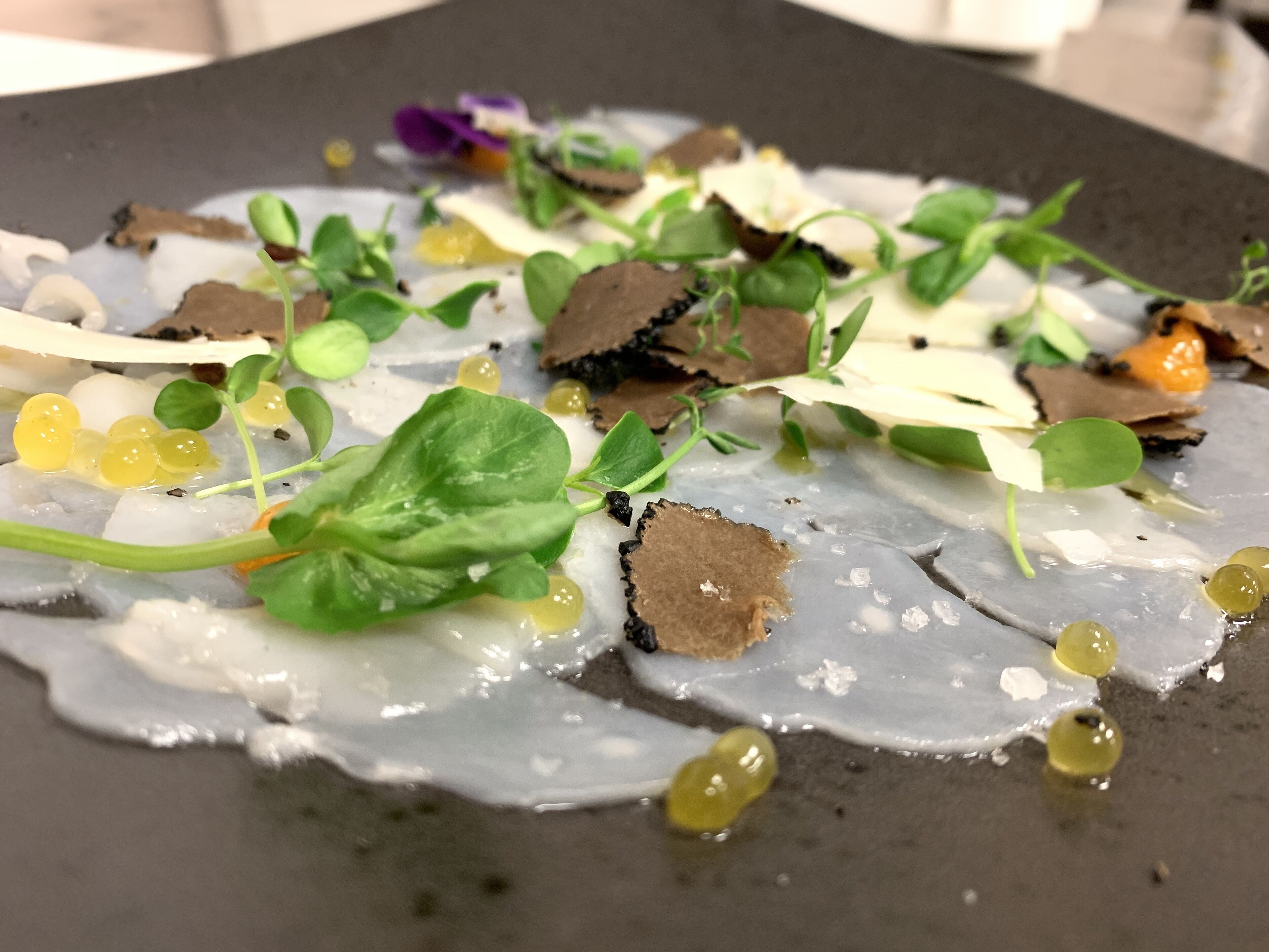 A dish with various ingredients on a plate.